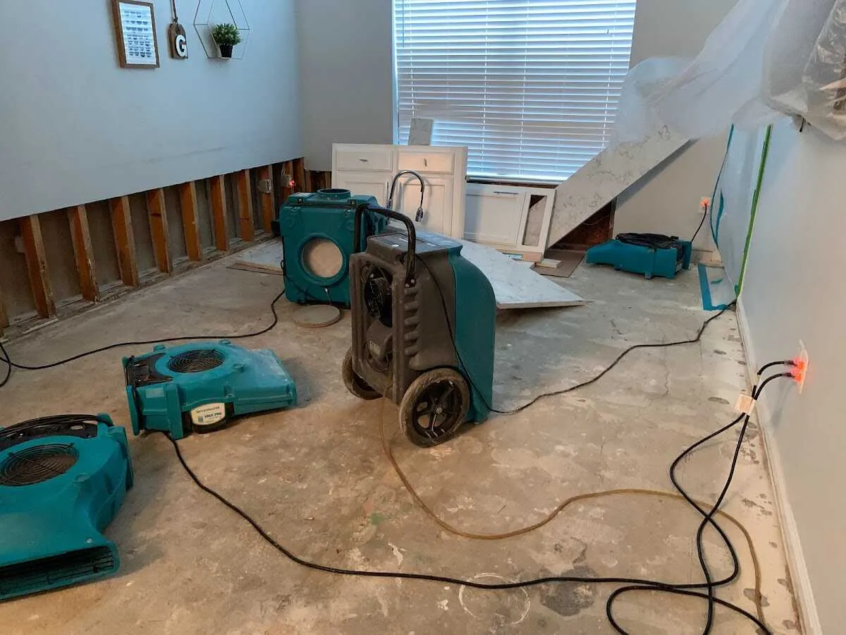 Dehumidifier in flood-cut room for Water Damage Restoration in McKenzie